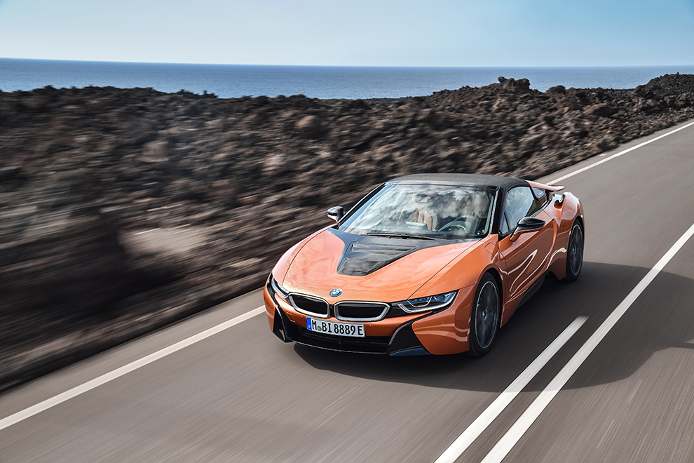 The BMW AG roadster in orange and the luxury briefing 